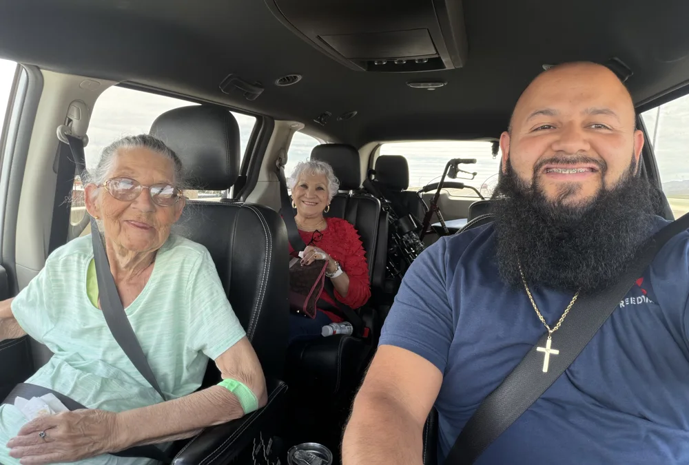 Jorge with two clients he transports to their appointments